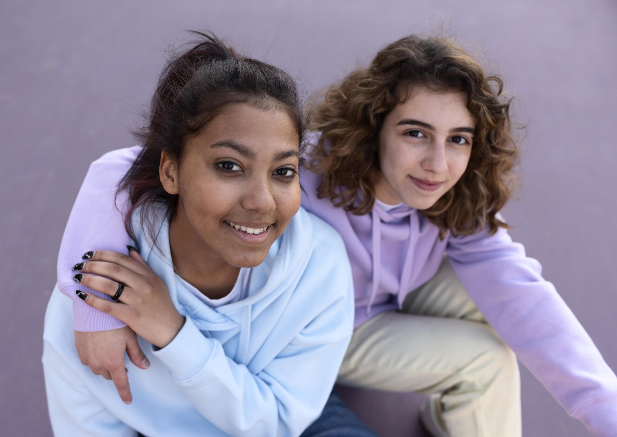 medium-shot-girls-sitting-outdoors