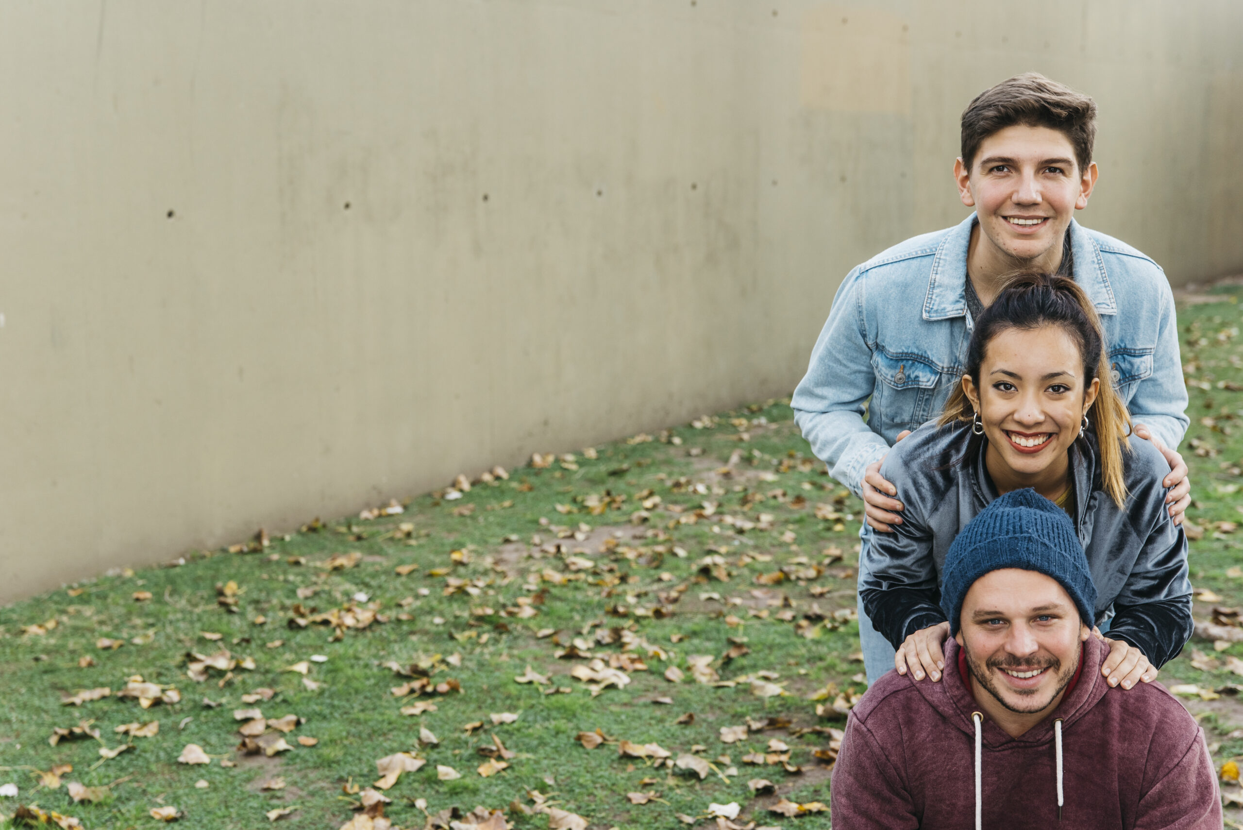 young-smiling-multiracial-friends-standing-one-after-another